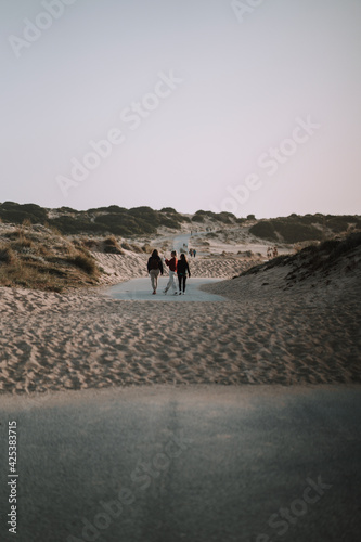 Group of people walking at the beach near the Cape Trafalgar lighthouse