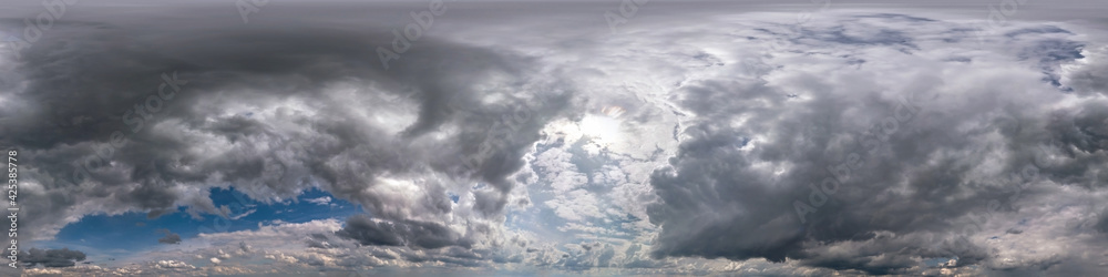 blue sky with beautiful dark clouds before storm. Seamless hdri panorama 360 degrees angle view with zenith for use in 3d graphics or game development as sky dome or edit drone shot