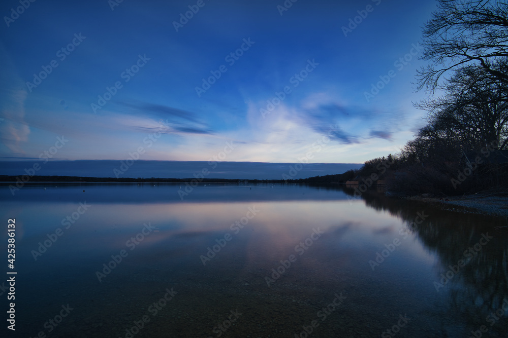 sunrise over the lake and cloud reflections