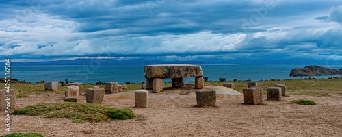 Stone table - sacrificial altar, ruins on the Island of Sun (Isla del Sol) on Titicaca lake in Bolivia photo