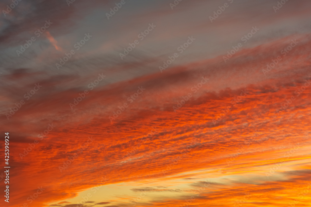 Vivid orange red sunset with dense cloud cover