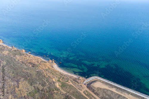 Seashore with turquoise water. Conceptual photo - sea and coast. Helicopter view.