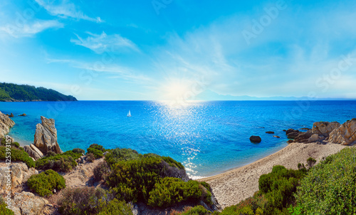 Summer morning sunshiny sandy beach and rocky coast near Platanitsi Beach, Sithonia Peninsula, Chalcidice, Greece