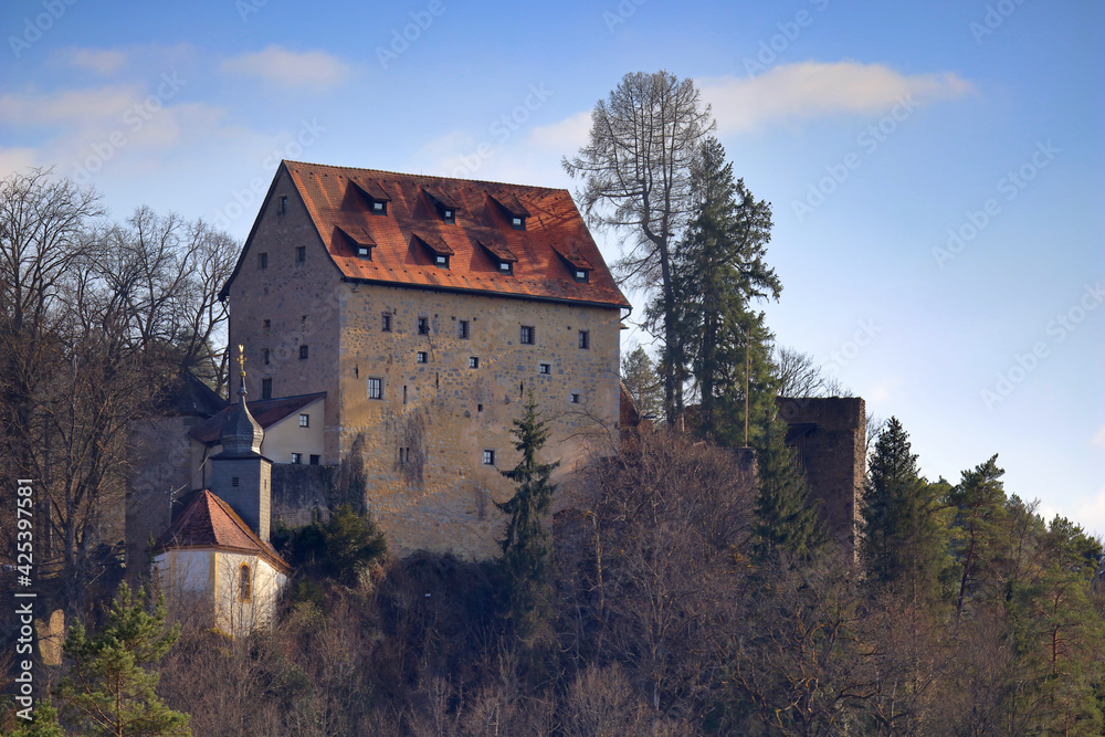 view of a medieva castle in the woodlands on top of a mountain in upper franconia view of a medieva castle in the woodlands on top of a mountain in upper franconia