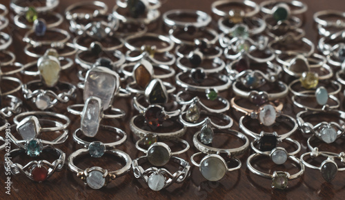 Set of silver rings on a wooden table