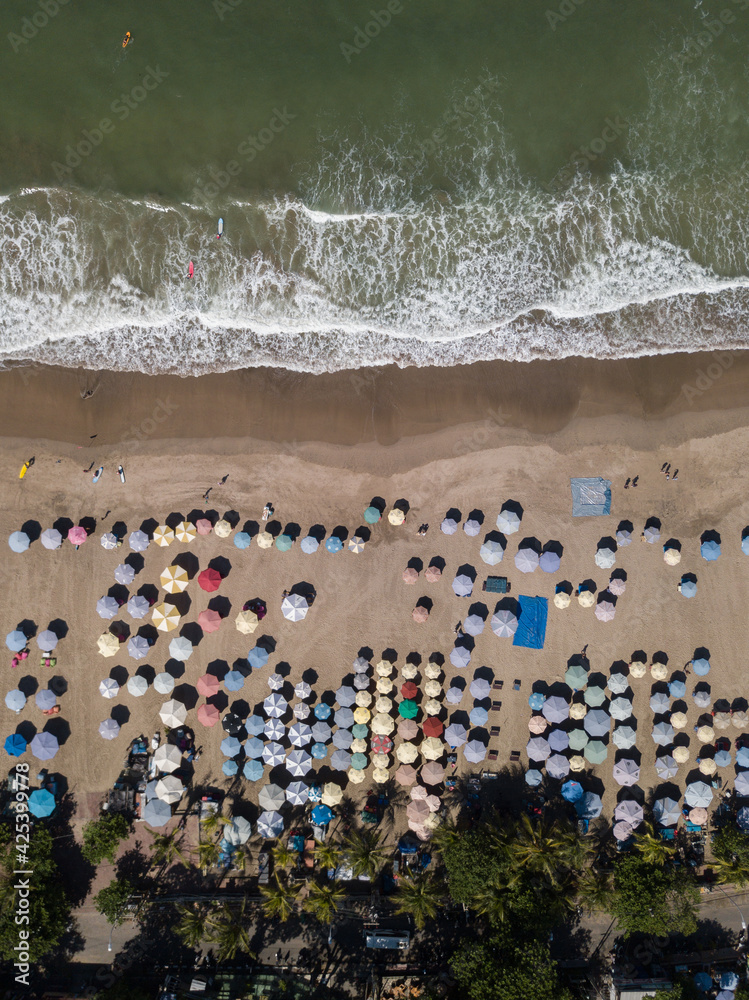 aerial view on the beach and sun umbrellas in the morning aerial view on the beach and sun umbrellas in the morning