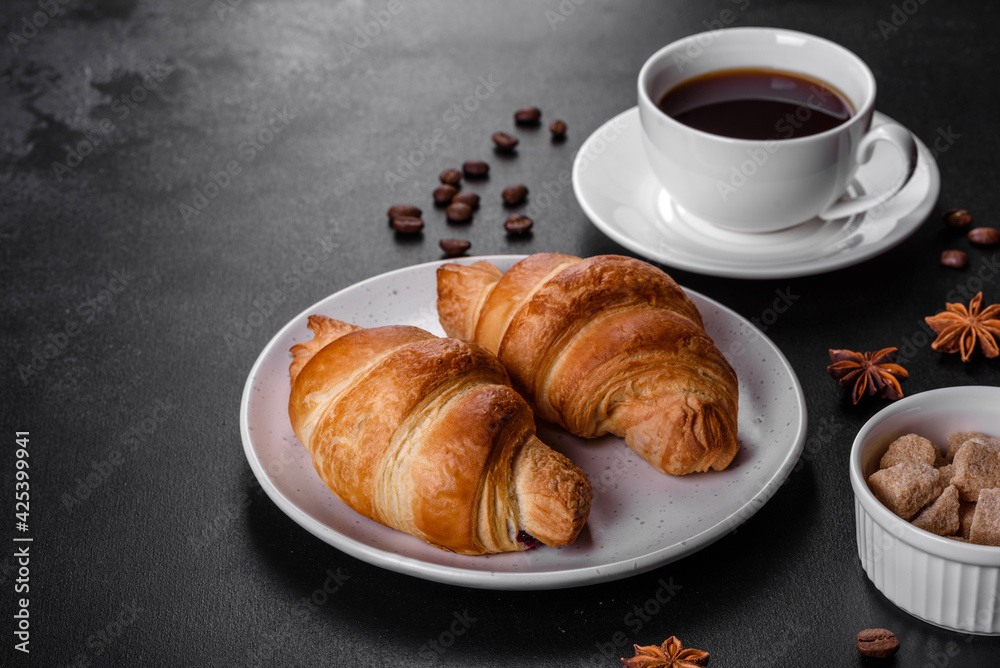 Fresh crisp delicious French croissant with a cup of fragrant coffee Fresh crisp delicious French croissant with a cup of fragrant coffee