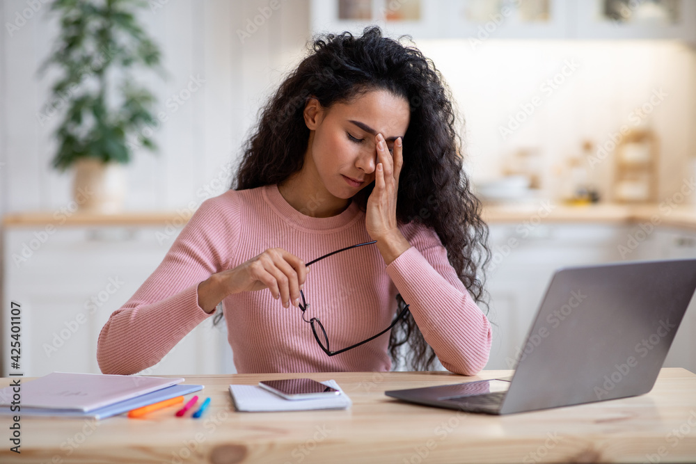 Eyes Strain. Tired Female Freelancer Feeling Fatigue After Online Work On Laptop Eyes Strain. Tired Female Freelancer Feeling Fatigue After Online Work On Laptop