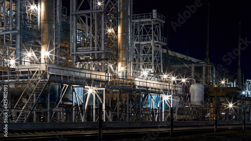 Night industrial petrochemical landscape. Methanol synthesis process mixed reforming reactors columns. Methanol production CO2 utilization by methanol reactor column for alternative to petroleum fuels