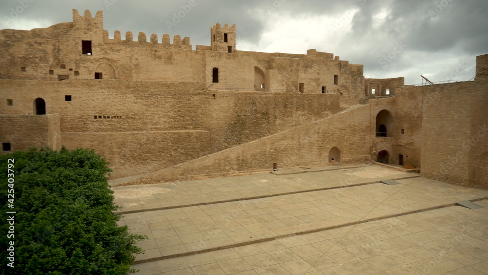 Panorama of the ancient Ribat fortress in Monastir, Tunisia. Old yellow bricks. View from right to left
