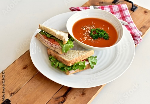 Tasty comfort meal soup and sandwich for cool blustery spring day. Food background, photo concept, healthy lifestyle eating. 