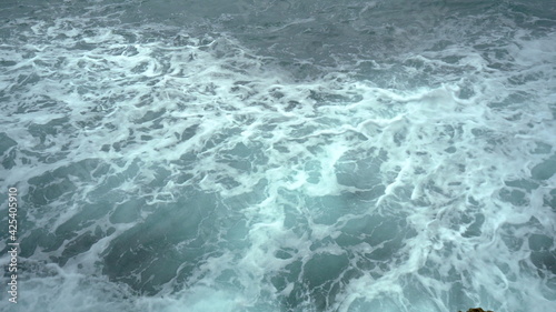 View of the foaming waves of the sea. Turquoise sea