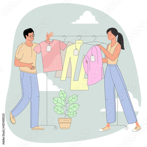 people choosing clothes in clothing store