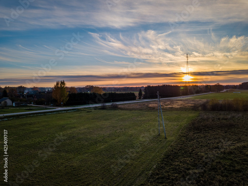 Drone photo of empty road leading through the rural village © Reinholds