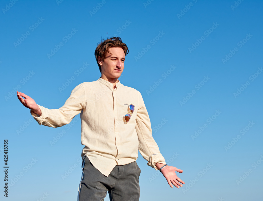 A Caucasian man from Spain acting confused and surprised on clear sky background A Caucasian man from Spain acting confused and surprised on clear sky background
