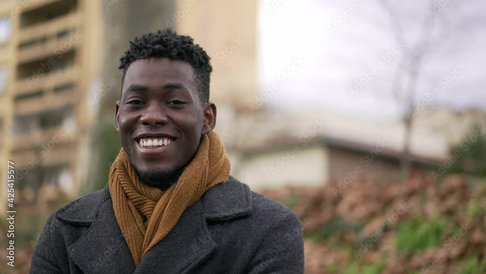 Charismatic happy friend black man portrait face smiling at camera Charismatic happy friend black man portrait face smiling at camera