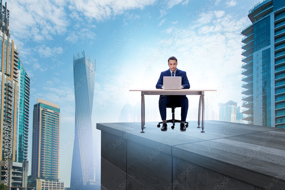 Businessman self isolating on the top Businessman self isolating on the top
