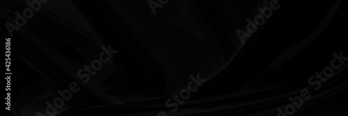 Black gray satin dark fabric texture luxurious shiny that is abstract silk cloth panorama background with patterns soft waves blur beautiful.