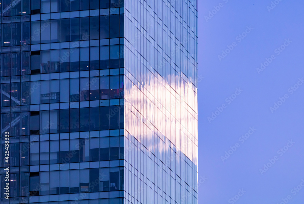 modern office building with sky reflections