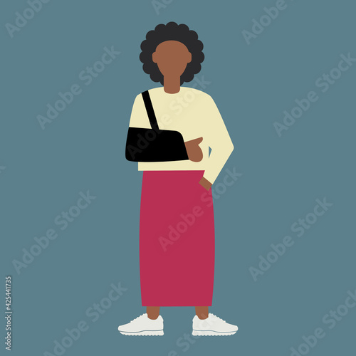 Afro-American female with injured arm in a sling