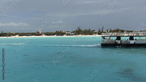 Engine boat and Half Moon Cay island, Bahamas photo