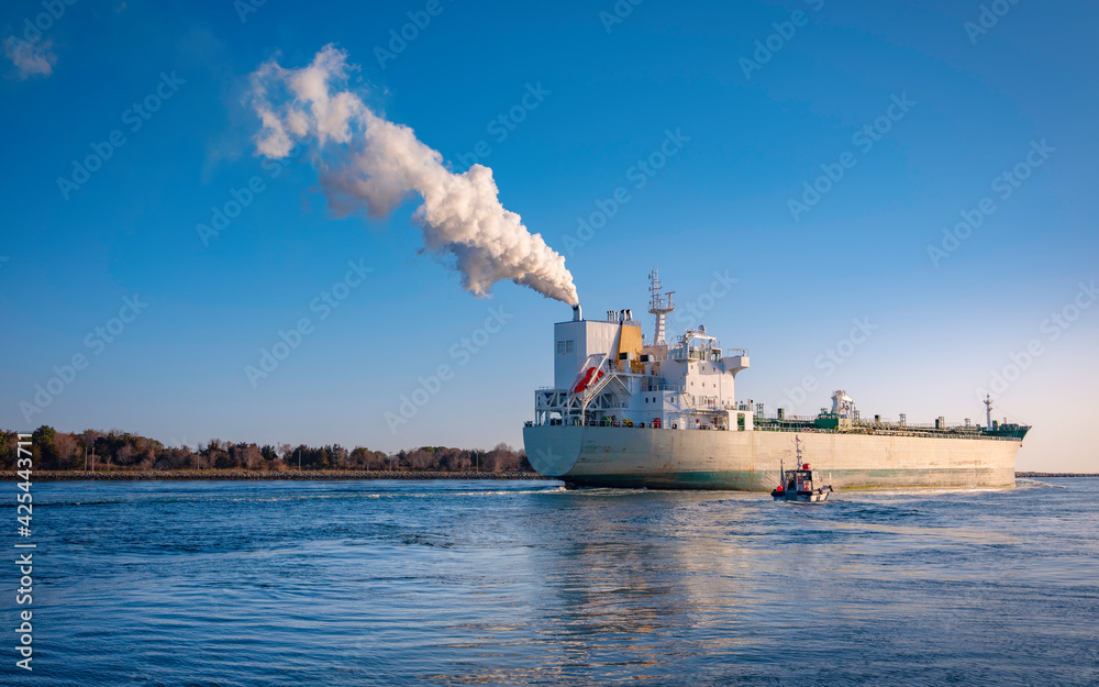 Large Steam Ship Passing through Cape Cod Canal. Cargo Carrier and