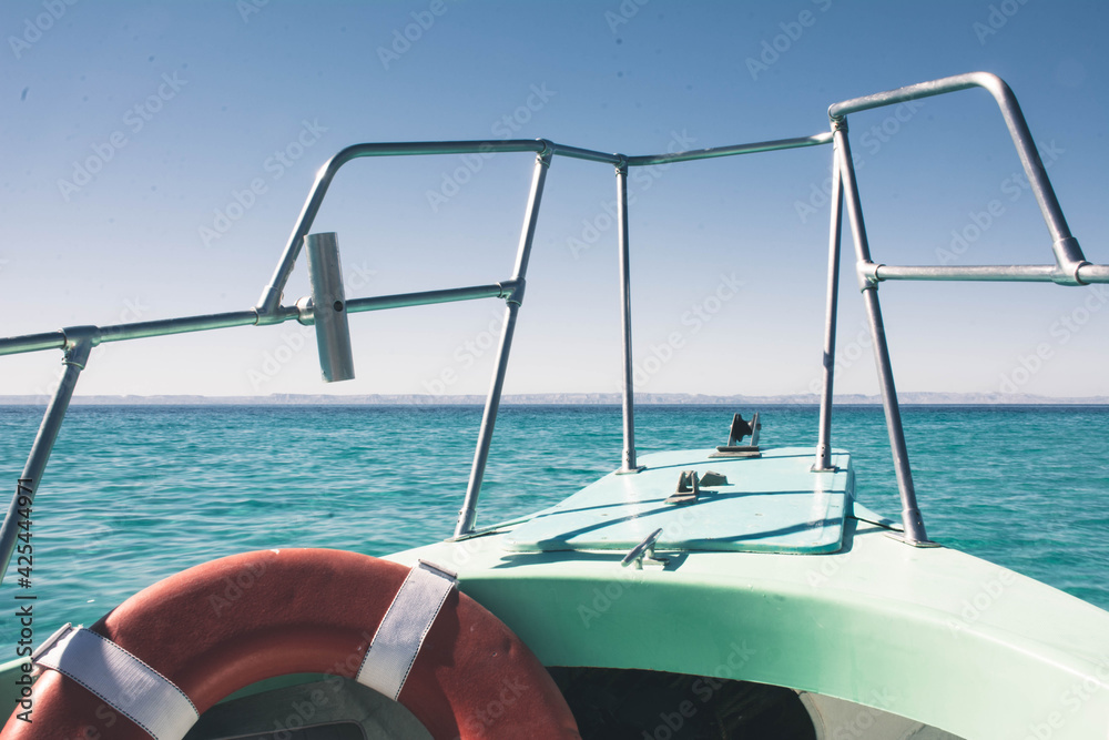 Obraz premium small boat on open sea