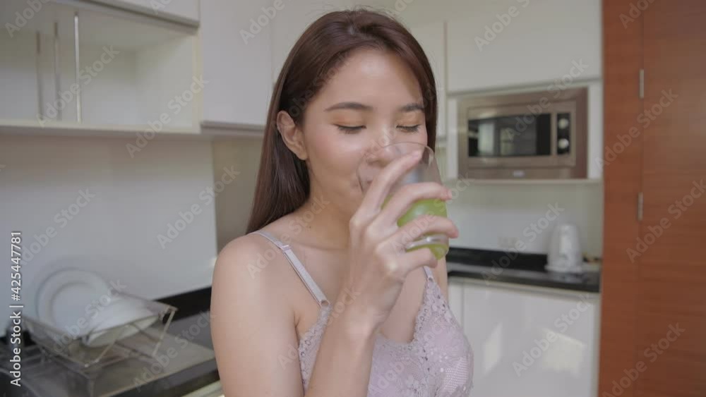Health concept of 4k Resolution. Asian girls are drinking healthy fruit and vegetable juices. Health concept of 4k Resolution. Asian girls are drinking healthy fruit and vegetable juices.