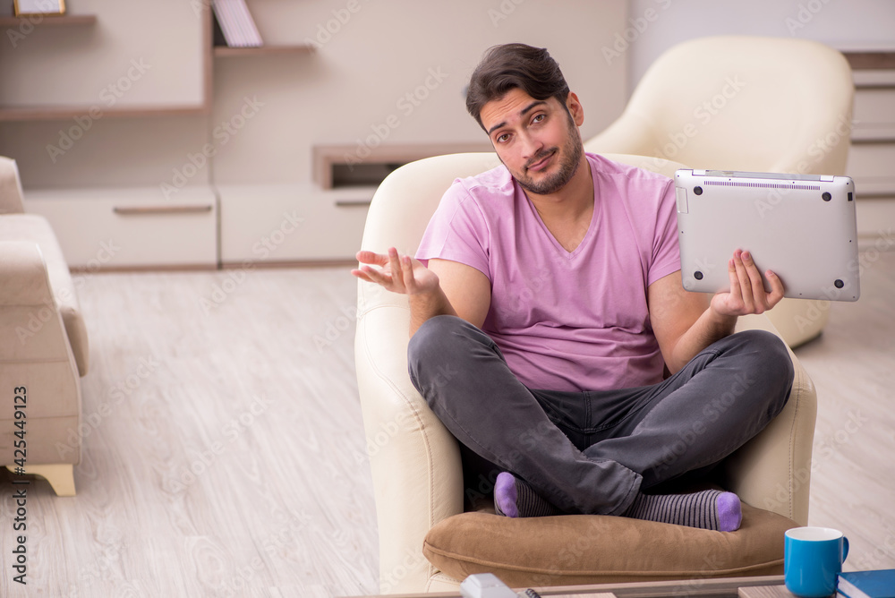 Young man working from home during pandemic
