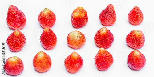 Red strawberries on white background.