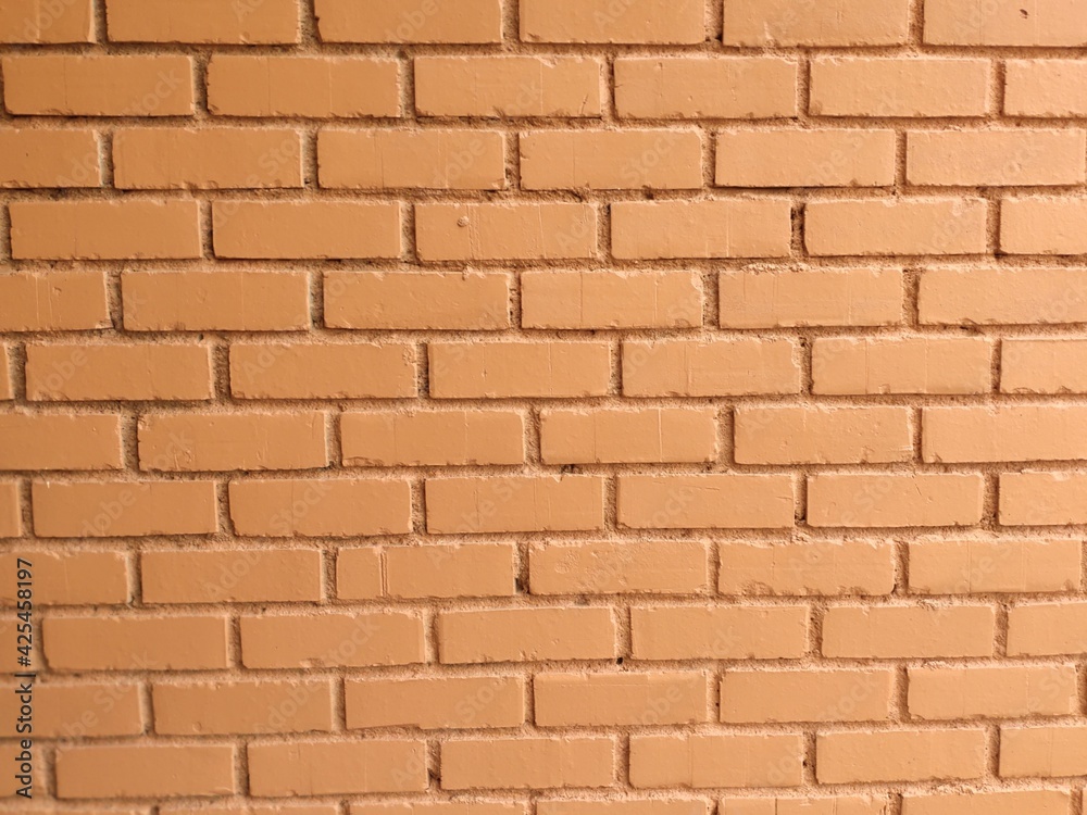 Obraz premium Orange Brick wall background for presentation backdrops