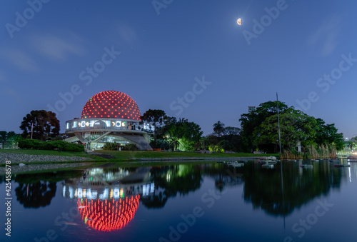 reflection in the water. moon. Planetario galileo galilei buenos aires night. Clear and blue night sky