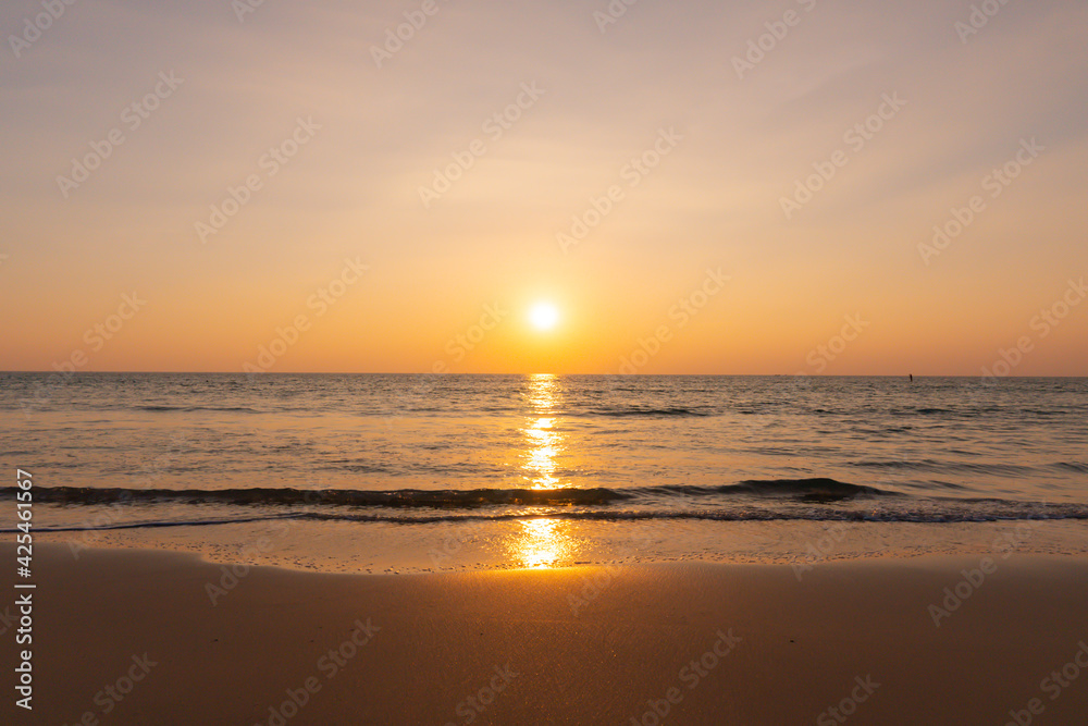 Sunset beach sand and sew water clear. Nature image view of beautiful tropical beach and sea in sunny day. Sunset at beach. At Phuket, Thailand.