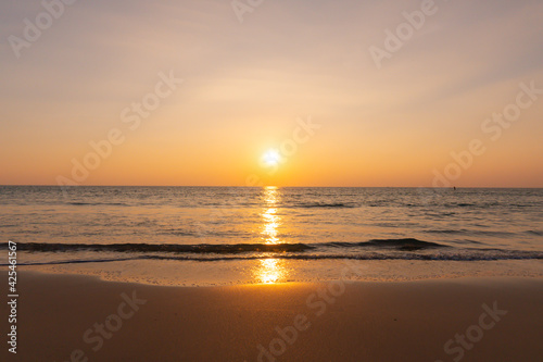 Sunset beach sand and sew water clear. Nature image view of beautiful tropical beach and sea in sunny day. Sunset at beach. At Phuket, Thailand.