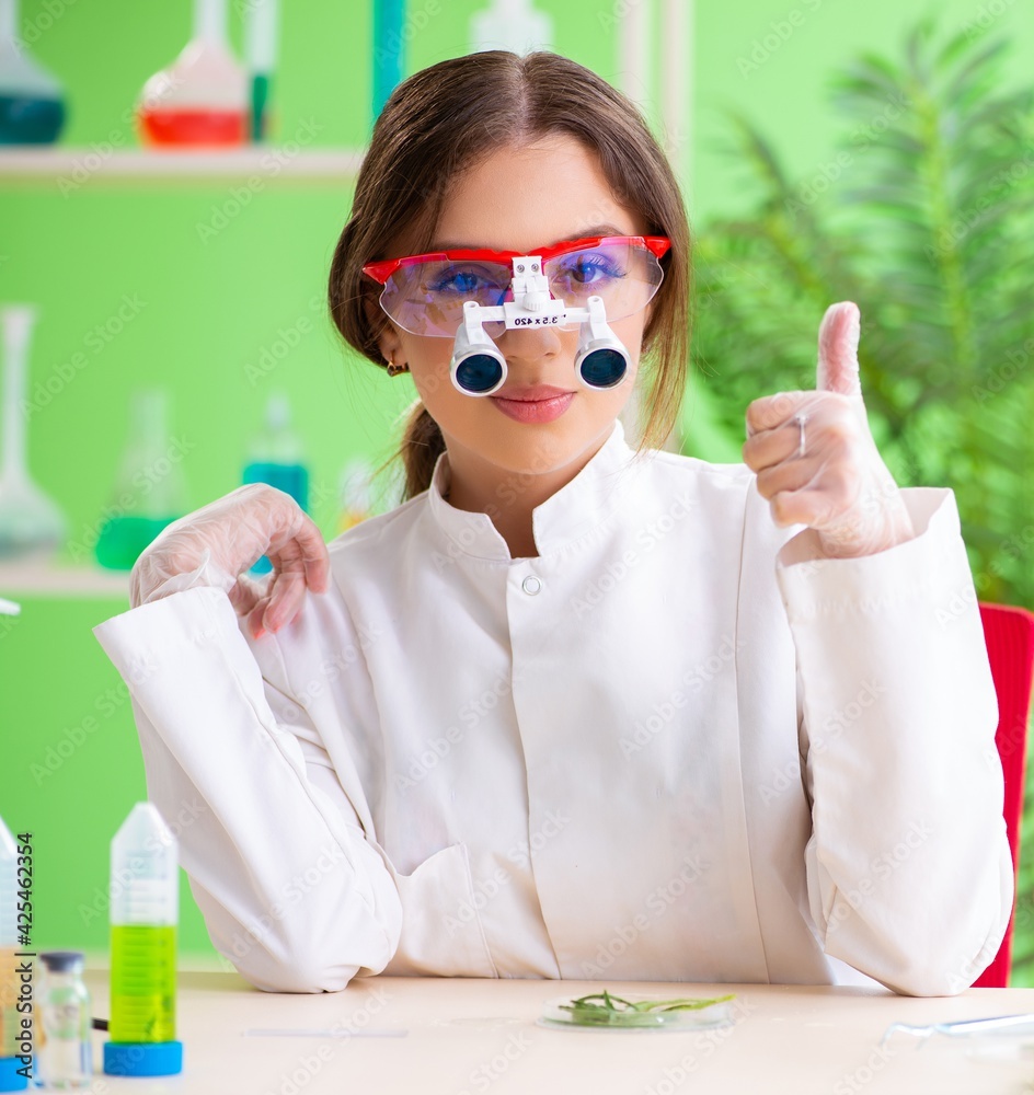 Beautiful female biotechnology scientist chemist working in lab Beautiful female biotechnology scientist chemist working in lab