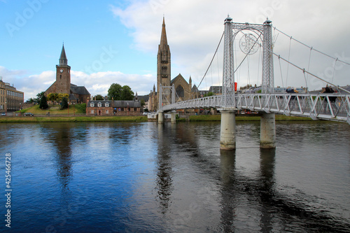 Bridge and Church of Inverness Scotland with Blue Sky Reflected in River
