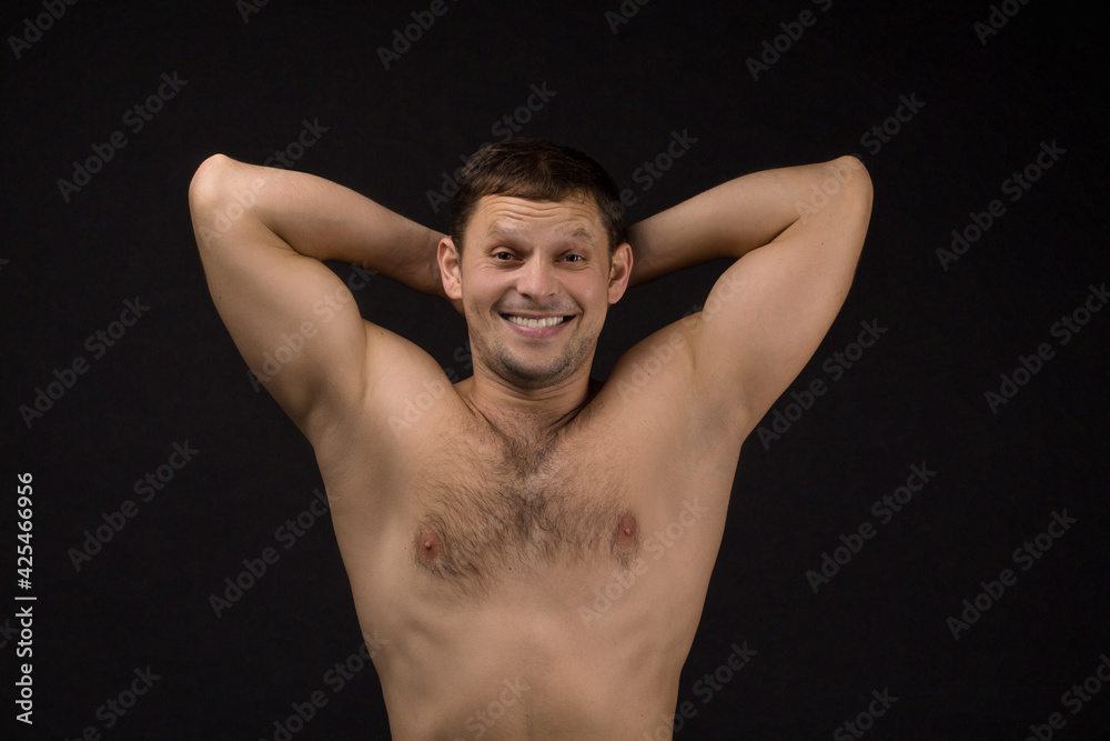 Handsome man in underwear on the black background. Muscular and athletic. Man portrait. Male model in studio