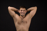 Handsome man in underwear on the black background. Muscular and athletic. Man portrait. Male model in studio