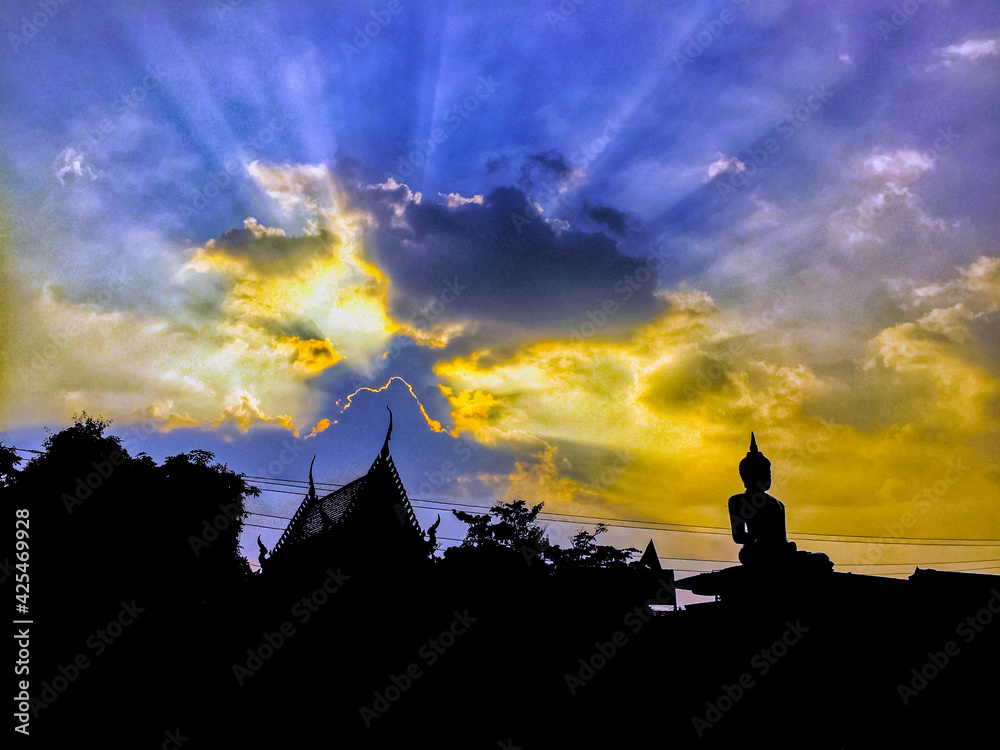 Silhouette of Buddha statue at twilight time with amazing sky in Thailand ,religion,