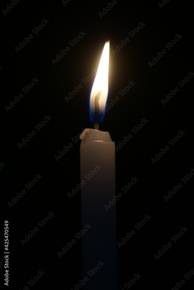 Stock photo of brightly lit candles providing light in the dark during power cuts. suitable for candle product photos or any other business about candles and flames Stock photo of brightly lit candles providing light in the dark during power cuts. suitable for candle product photos or any other business about candles and flames
