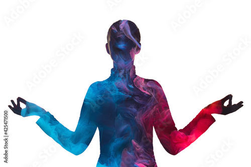 Double exposure silhouette. Inner peace. Harmony balance. Blue pink ethereal mist chakra in dark contrast outline of tranquil woman in yoga pose isolated on white background.