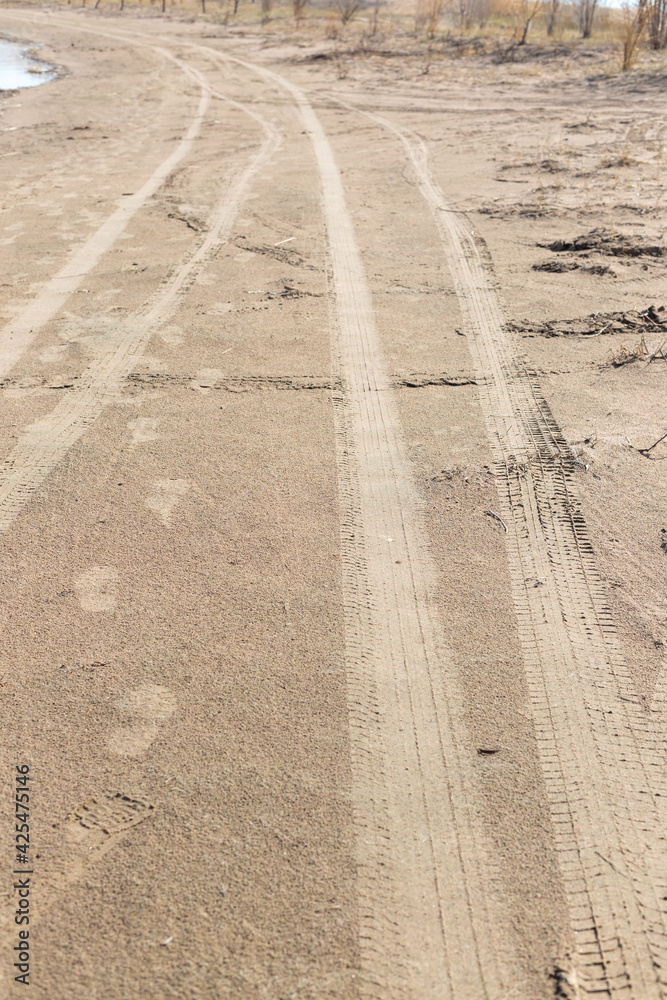 Abstract background - the wheel tracks in the sand. Abstract background - the wheel tracks in the sand.