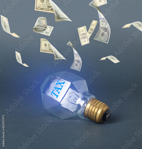 Light bulb with word TAX an...