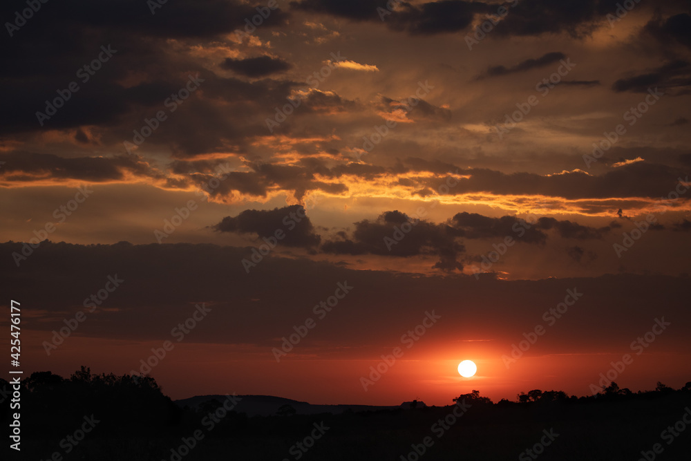 sunset with red and orange clouds in Africa