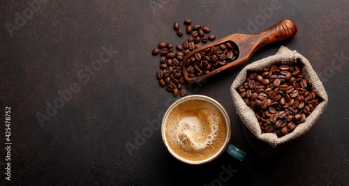 Roasted coffee beans and espresso cup