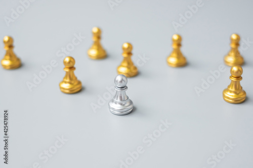 golden chess pawn pieces stand out of people. Different, unique, individual and Social distancing prevent coronavirus infection concept