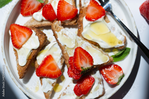 Fototapeta Naklejka Na Ścianę i Meble -  Healthy food breakfast strawberry toast with butter cream