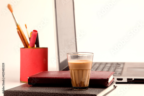Laptop and Diary with cup of tea. work from home concept
