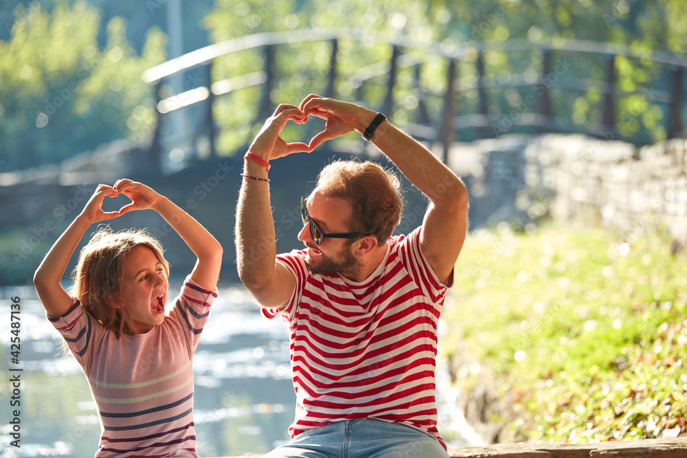 Obraz premium Daughter and father enjoying outdoors nature.