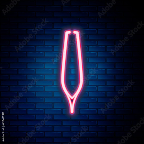 Glowing neon line Eyebrow tweezers icon isolated on brick wall background. Cosmetic tweezers for ingrown hair. Colorful outline concept. Vector